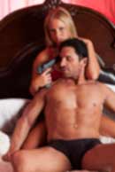 weapon, gun, Sexy sensual heterosexual couple, man, young caucasian woman in love on bed kissing, hugging. Beautiful passionate couple is having sex in a bedroom. Portrait of passion, pleasure, sex, relationship. Copulating